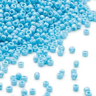 Seed bead, Dyna-Mites™, glass, opaque rainbow light turquoise blue, #11 round. Sold per 40-gram pkg.