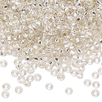 Seed bead, Preciosa Ornela, Czech glass, transparent silver-lined crystal clear, #8 rocaille with square hole. Sold per 50-gram pkg.