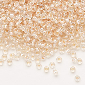 Seed bead, Preciosa Ornela, glass, translucent salmon pearl-lined crystal clear, #8 rocaille. Sold per 50-gram pkg.