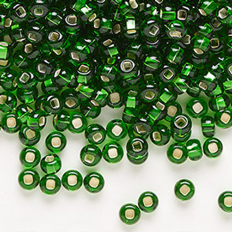Seed bead, Preciosa Ornela, Czech glass, transparent silver-lined green, #6 rocaille with square hole with square hole. Sold per 50-gram pkg.
