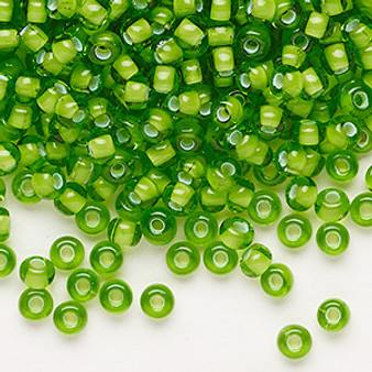 Seed bead, Preciosa Ornela, glass, transparent chalkwhite-lined green, #6 rocaille. Sold per 50-gram pkg.