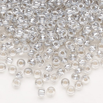 Seed bead, Preciosa Ornela, Czech glass, translucent color-lined pastel grey luster (382PD), #6 rocaille. Sold per 50-gram pkg.