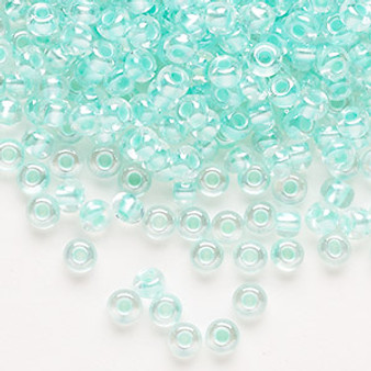 Seed bead, Preciosa Ornela, Czech glass, translucent color-lined pastel green luster (382PG), #6 rocaille. Sold per 50-gram pkg.