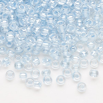Seed bead, Preciosa Ornela, Czech glass, translucent color-lined pastel blue luster (382PB), #6 rocaille. Sold per 50-gram pkg.
