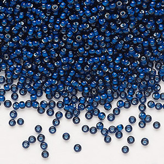 Seed bead, Preciosa Ornela, glass, transparent chalkwhite-lined dark aquamarine, #11 rocaille. Sold per 500-gram pkg.