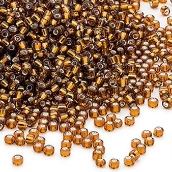 Seed bead, Dyna-Mites™, glass, silver-lined transparent root beer, #11 round. Sold per 40-gram pkg.