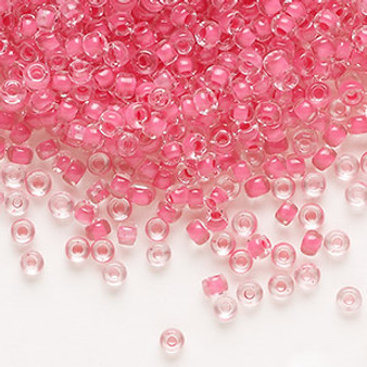 Seed bead, Dyna-Mites™, glass, translucent inside color pink, #8 round. Sold per 40-gram pkg.