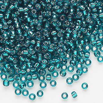 Seed bead, Dyna-Mites™, glass, silver-lined translucent teal blue, #8 round. Sold per 40-gram pkg.