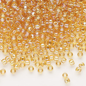 Seed bead, Dyna-Mites™, glass, transparent rainbow amber yellow, #8 round. Sold per 40-gram pkg.