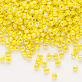 Seed bead, Dyna-Mites™, glass, opaque rainbow yellow, #8 round. Sold per 40-gram pkg.