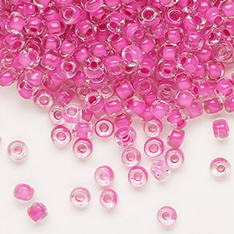 Seed bead, Dyna-Mites™, glass, translucent inside color hot pink, #6 round. Sold per 40-gram pkg.