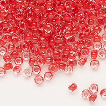 Seed bead, Dyna-Mites™, glass, translucent inside color red, #6 round. Sold per 40-gram pkg.