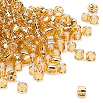 Seed bead, Dyna-Mites™, glass, silver-lined translucent gold, #6 round. Sold per 40-gram pkg.