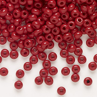 Seed bead, Preciosa Ornela, glass, opaque red coral, #6 rocaille. Sold per 50-gram pkg.