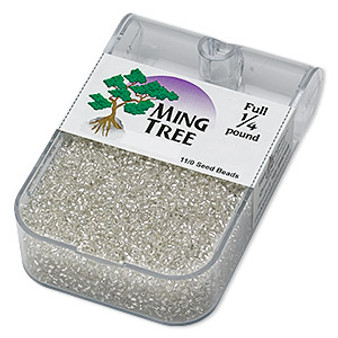 Seed bead, Ming Tree™, glass, silver-lined trans clear, #11 round. Sold per 1/4 pound pkg.