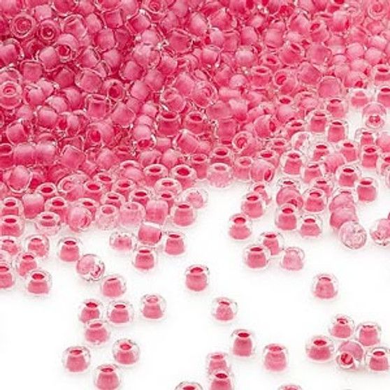 Seed bead, Dyna-Mites™, glass, translucent inside color pink, #11 round. Sold per 40-gram pkg.