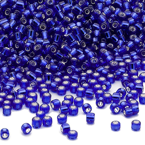 Seed bead, Dyna-Mites™, glass, silver-lined transparent cobalt, #11 round. Sold per 40-gram pkg.