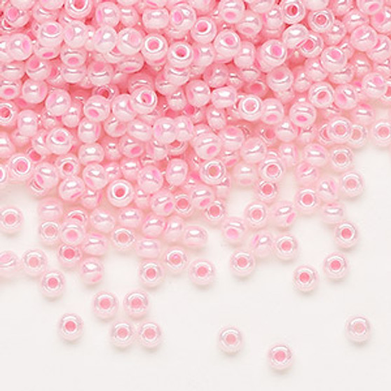 Seed bead, Preciosa Ornela, Czech glass, opaque pastel pink luster, #8 rocaille. Sold per 50-gram pkg.