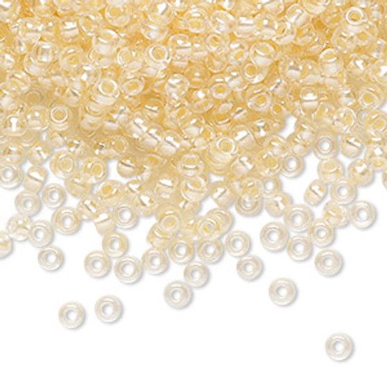 Seed bead, Preciosa Ornela, Czech glass, translucent color-lined pastel apricot luster, (382PA), #8 rocaille. Sold per 50-gram pkg.