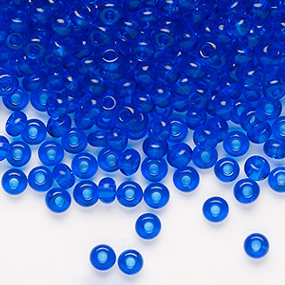 Seed bead, Preciosa Ornela, Czech glass, transparent sapphire blue, #6 rocaille. Sold per 50-gram pkg.