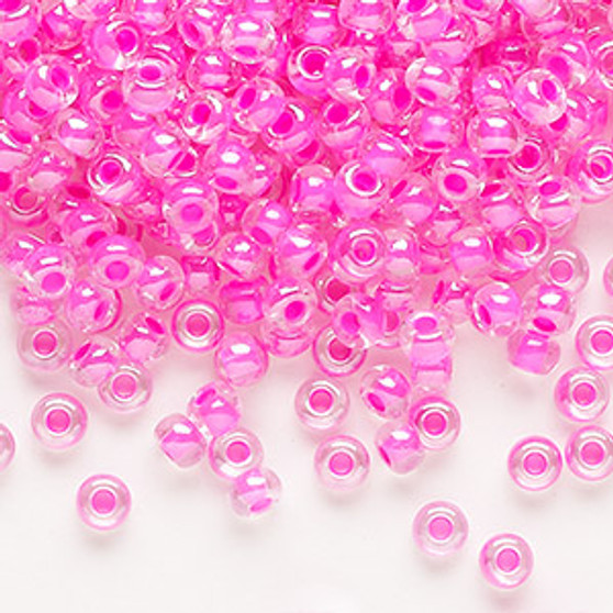 Seed bead, Preciosa Ornela, Czech glass, translucent color-lined pink luster (38177), #6 rocaille. Sold per 50-gram pkg.