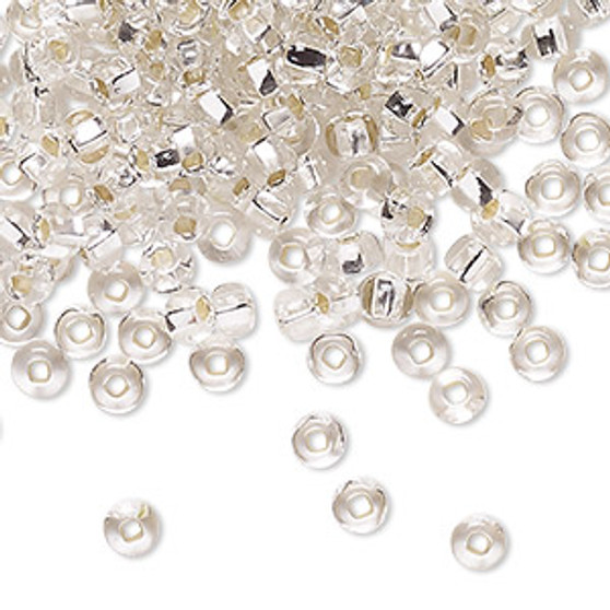 Seed bead, Preciosa Ornela, Czech glass, transparent silver-lined crystal clear, #6 rocaille with square hole. Sold per 50-gram pkg.