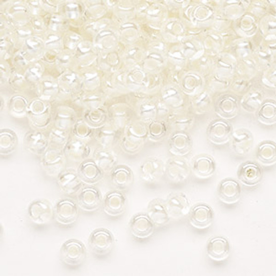 Seed bead, Preciosa Ornela, Czech glass, translucent color-lined pastel ivory luster (382PI), #6 rocaille. Sold per 50-gram pkg.