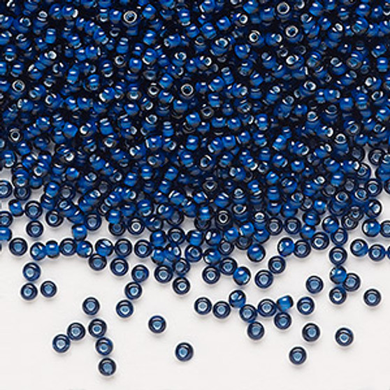 Seed bead, Preciosa Ornela, glass, transparent chalkwhite-lined dark aquamarine, #11 rocaille. Sold per 50-gram pkg.