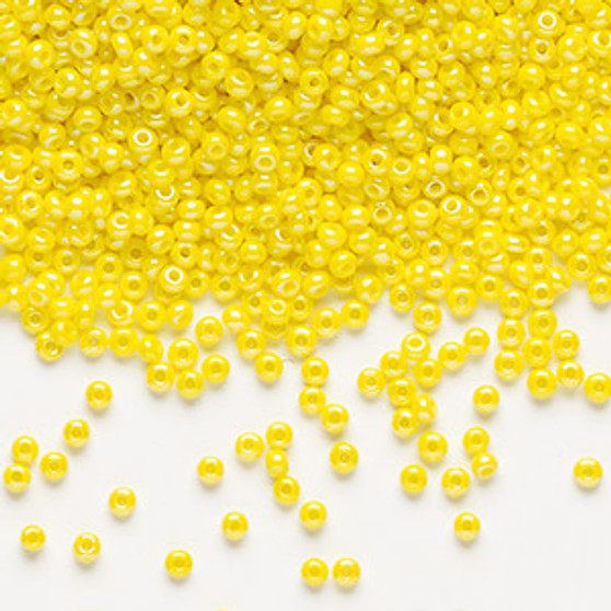 Seed bead, Preciosa Ornela, Czech glass, opaque rainbow lemon yellow (84110), #11 rocaille. Sold per 50-gram pkg.