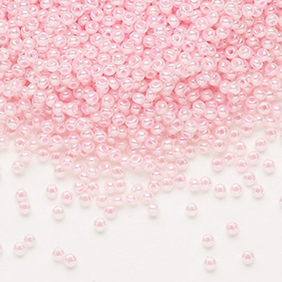 Seed bead, Preciosa Ornela, Czech glass, opaque pastel pink luster, #11 rocaille. Sold per 500-gram pkg.