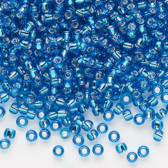 Seed bead, Dyna-Mites™, glass, silver-lined translucent turquoise blue, #8 round. Sold per 40-gram pkg.
