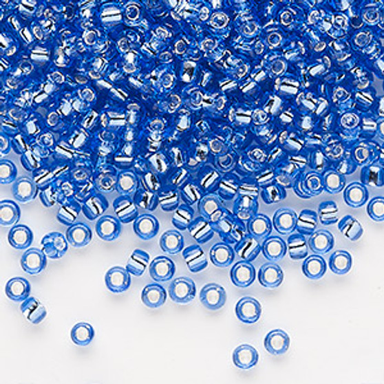 Seed bead, Dyna-Mites™, glass, silver-lined translucent blue, #8 round. Sold per 40-gram pkg.