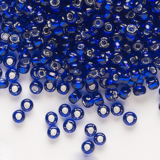Seed bead, Dyna-Mites™, glass, silver-lined translucent cobalt, #6 round. Sold per 40-gram pkg.