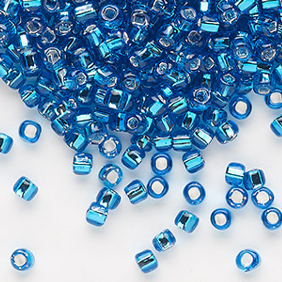 Seed bead, Dyna-Mites™, glass, silver-lined translucent turquoise blue, #6 round with square hole. Sold per 40-gram pkg.