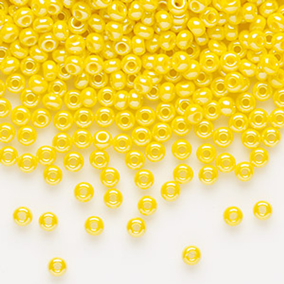 Seed bead, Preciosa Ornela, glass, opaque luster yellow, #8 rocaille. Sold per 50-gram pkg.