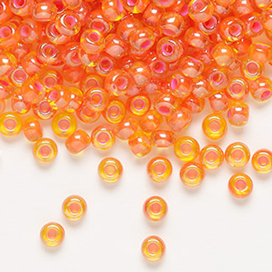 Seed bead, Preciosa Ornela, glass, translucent pink-lined luster yellow amber (81016), #6 rocaille. Sold per 50-gram pkg.