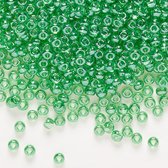 Seed bead, Preciosa Ornela, Czech glass, translucent light green luster, #8 rocaille. Sold per 50-gram pkg.