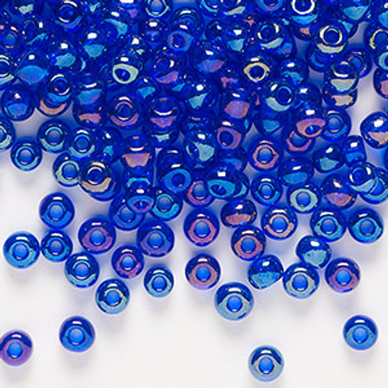 Seed bead, Preciosa Ornela, Czech glass, translucent rainbow blue, #6 rocaille. Sold per 50-gram pkg.