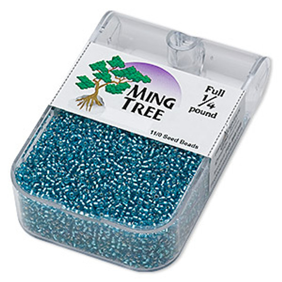 Seed bead, Ming Tree™, glass, silver-lined translucent turquoise blue, #11 round. Sold per 1/4 pound pkg.