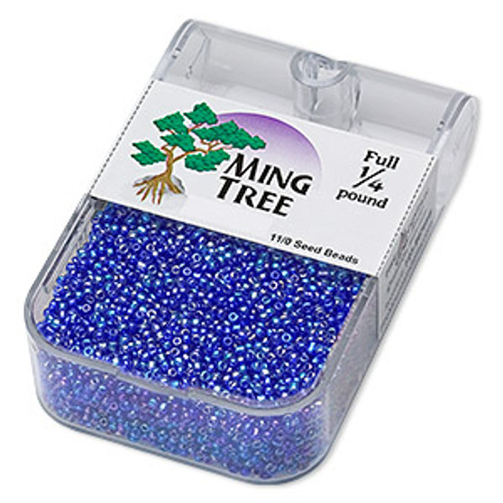 Seed bead, Ming Tree™, glass, transparent rainbow cobalt, #11 round. Sold per 1/4 pound pkg.