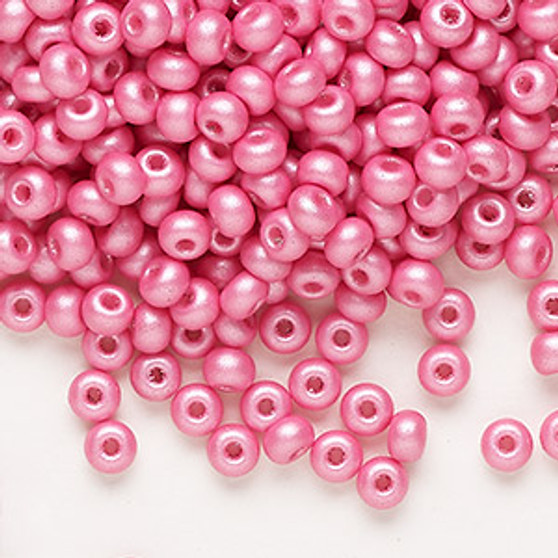 Seed bead, Preciosa Ornela, Czech glass, opaque chalkwhite PermaLux dyed pink, #6 rocaille. Sold per 50-gram pkg.