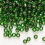 Seed bead, Preciosa Ornela, Czech glass, transparent silver-lined green, #6 rocaille with square hole with square hole. Sold per 50-gram pkg.