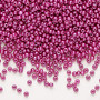 Seed bead, Preciosa Ornela, Czech glass, opaque chalkwhite PermaLux dyed purple, #11 rocaille. Sold per 50-gram pkg.