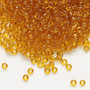 Seed bead, Dyna-Mites™, glass, transparent amber yellow, #8 round. Sold per 40-gram pkg.