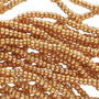 Seed bead, Preciosa Ornela, Czech glass, Metallic Gold (18389), #8 round. Sold per half hank.