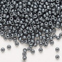 Seed bead, Preciosa Ornela, Czech glass, opaque chalkwhite PermaLux dyed black, #8 rocaille. Sold per 50-gram pkg.