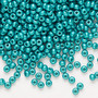 Seed bead, Preciosa Ornela, Czech glass, opaque chalkwhite PermaLux dyed green, #8 rocaille. Sold per 50-gram pkg.