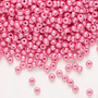 Seed bead, Preciosa Ornela, Czech glass, opaque chalkwhite PermaLux dyed pink, #8 rocaille. Sold per 50-gram pkg.