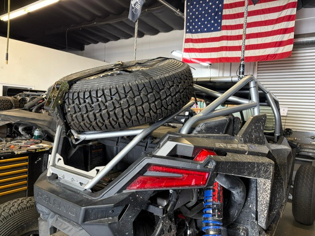 Polaris RZR Pro R fitted with the UTV Wolfpack tire carrier and spare tire, built in the USA
