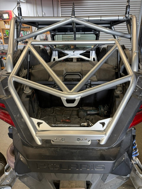 UTV Wolfpack Polaris Pro R tire carrier frame showing the gas strut mounts and high clearance tube construction